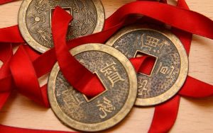 The chinese coins tied with a red ribbon